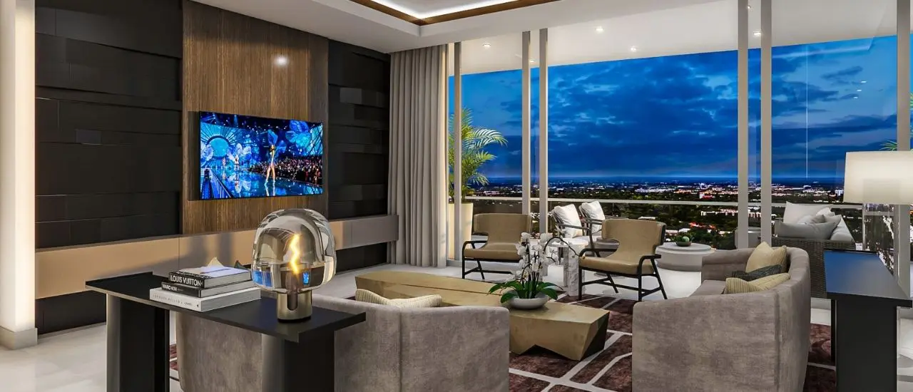 A living room with a large window and a view of the city.