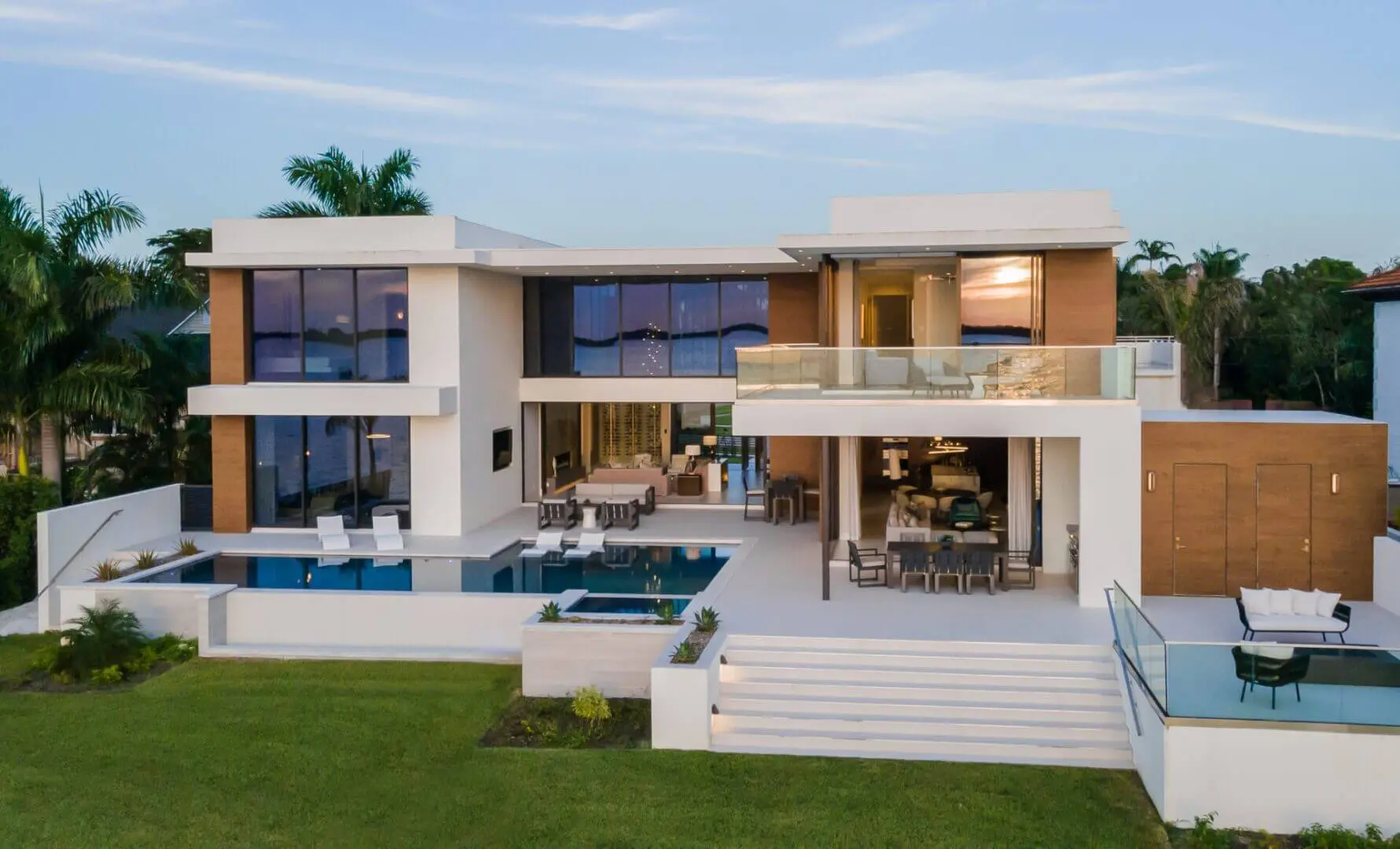 A large modern house with pool and patio.