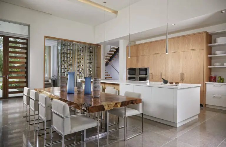 A pool with an outdoor bar and television.