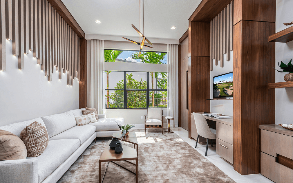 A living room with a couch, table and television.