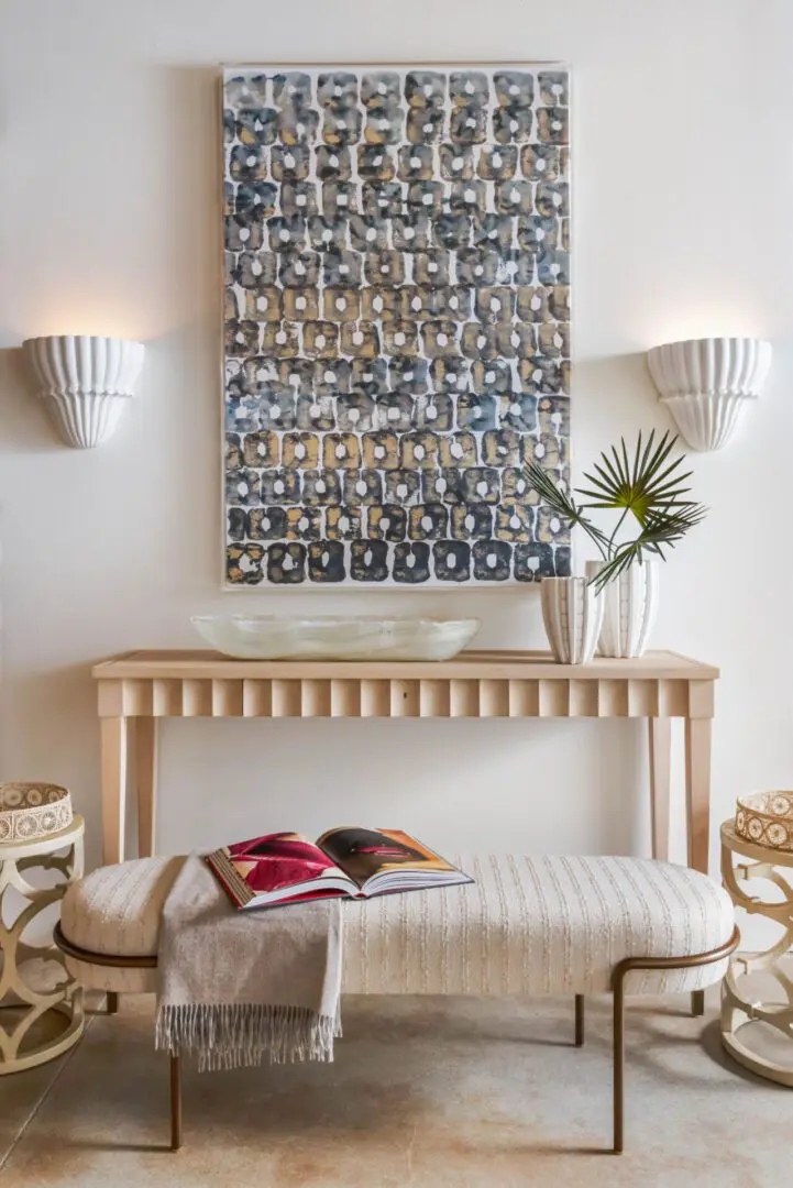 Room with a bench and a painting on the wall