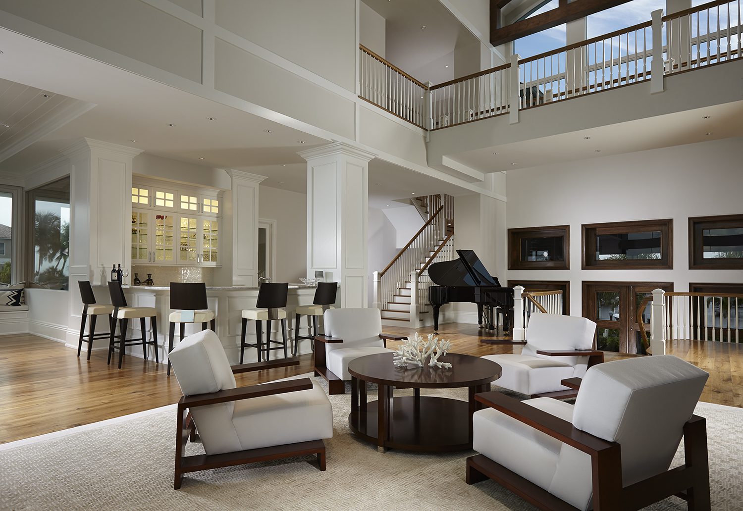 A living room with a piano and a table