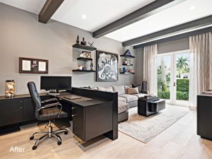 A living room with a desk and chair