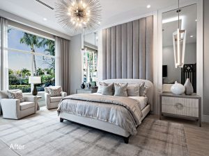 A bedroom with a large bed and a big window