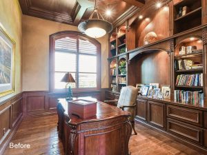 A large wooden desk in the middle of a room.