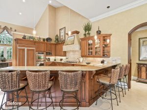 A large kitchen with lots of counter space and chairs.