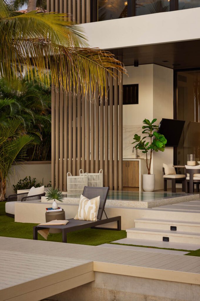 Modern outdoor patio with tropical plants.