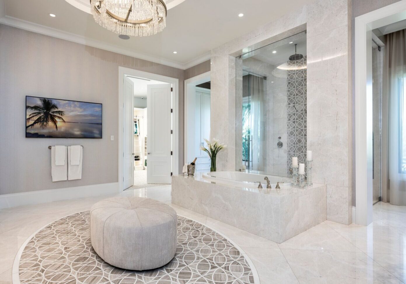 A large bathroom with a round rug and a television.