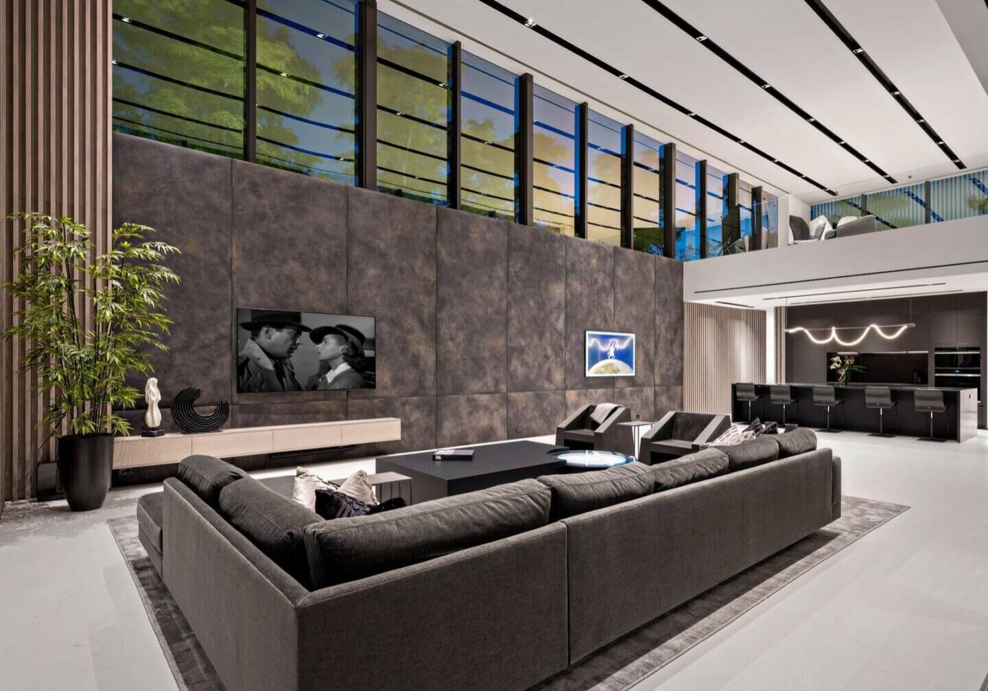 A living room with a large couch and television.
