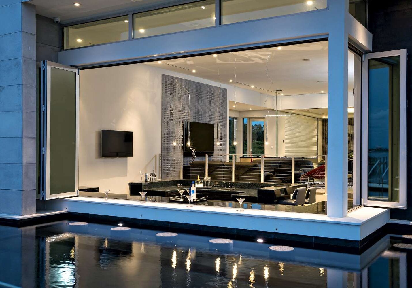 A living room with a large mirror and a pool