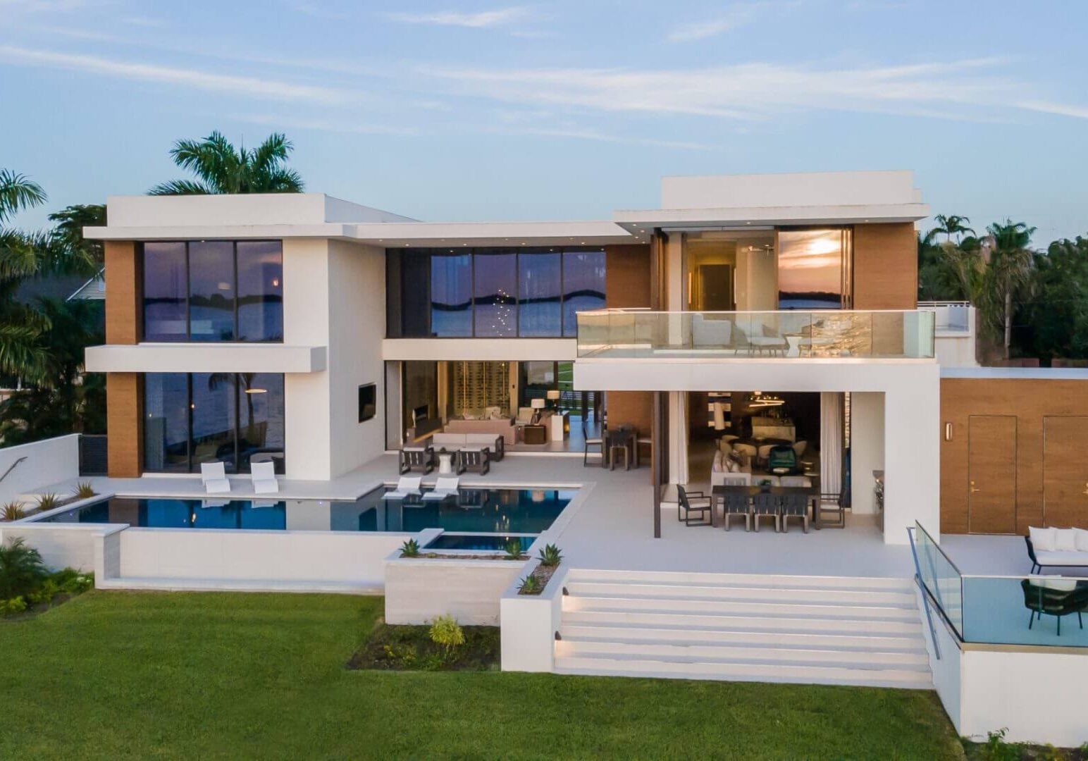 A large modern house with pool and patio.