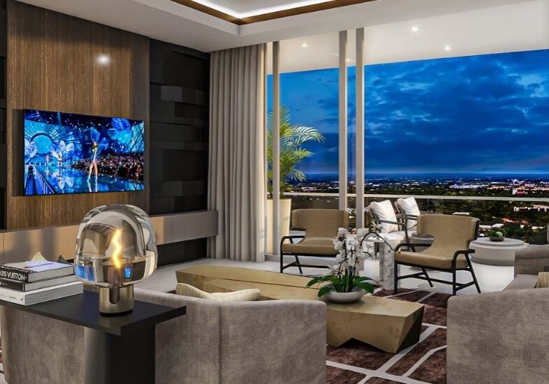 A living room with a large window and a view of the city.