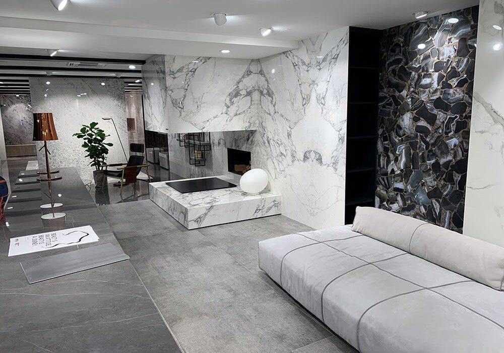 A living room with marble walls and floors