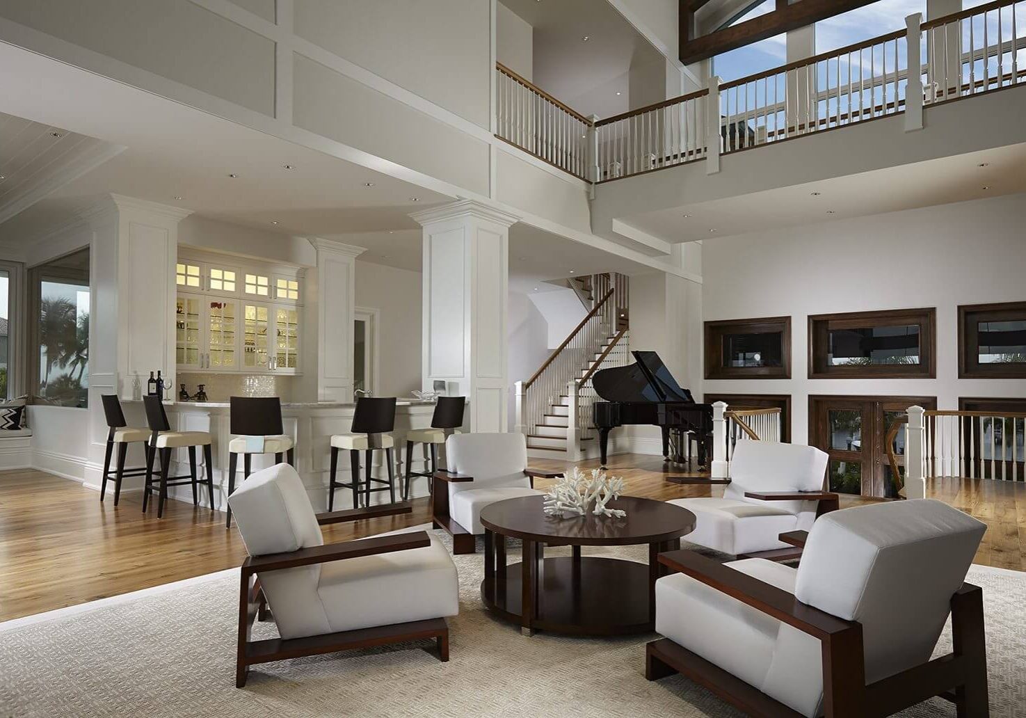 A living room with a piano and a table