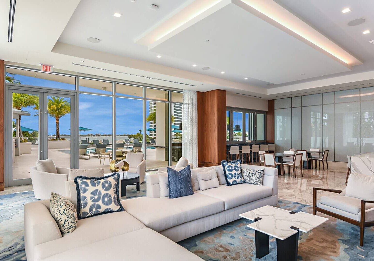 A living room with couches and tables in it