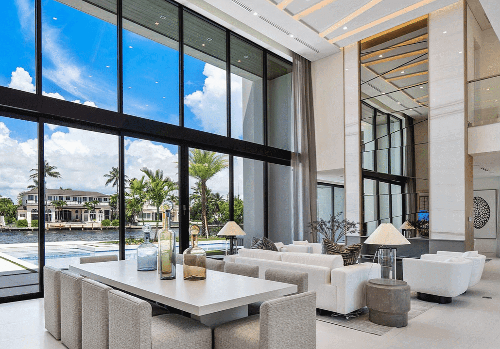 A large open living room with a pool view.